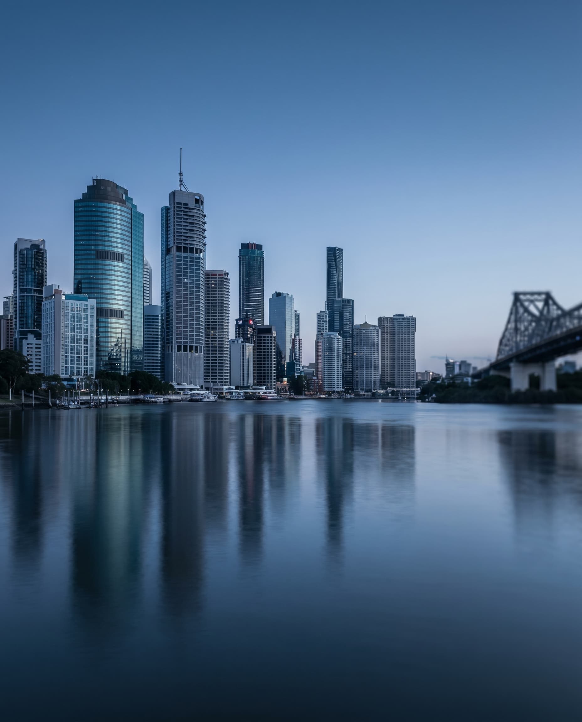 Brisbane CBD skyline at the blue hour, where Structly is based.